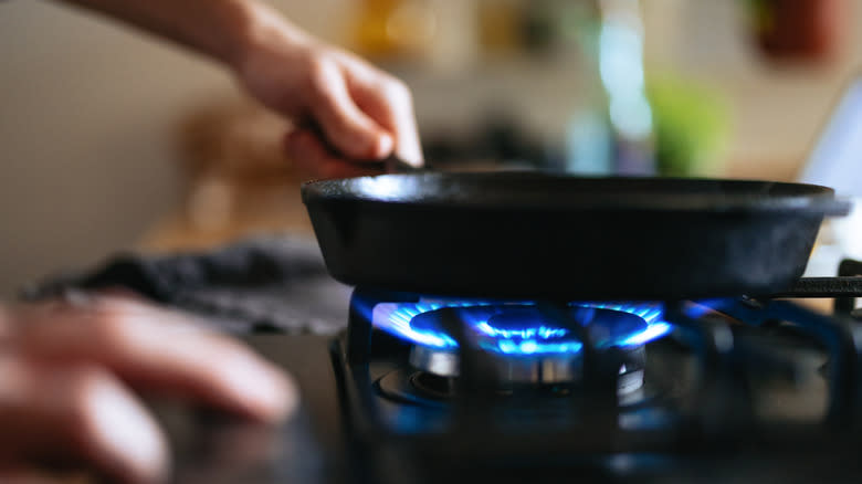 Frying pan over gas stove