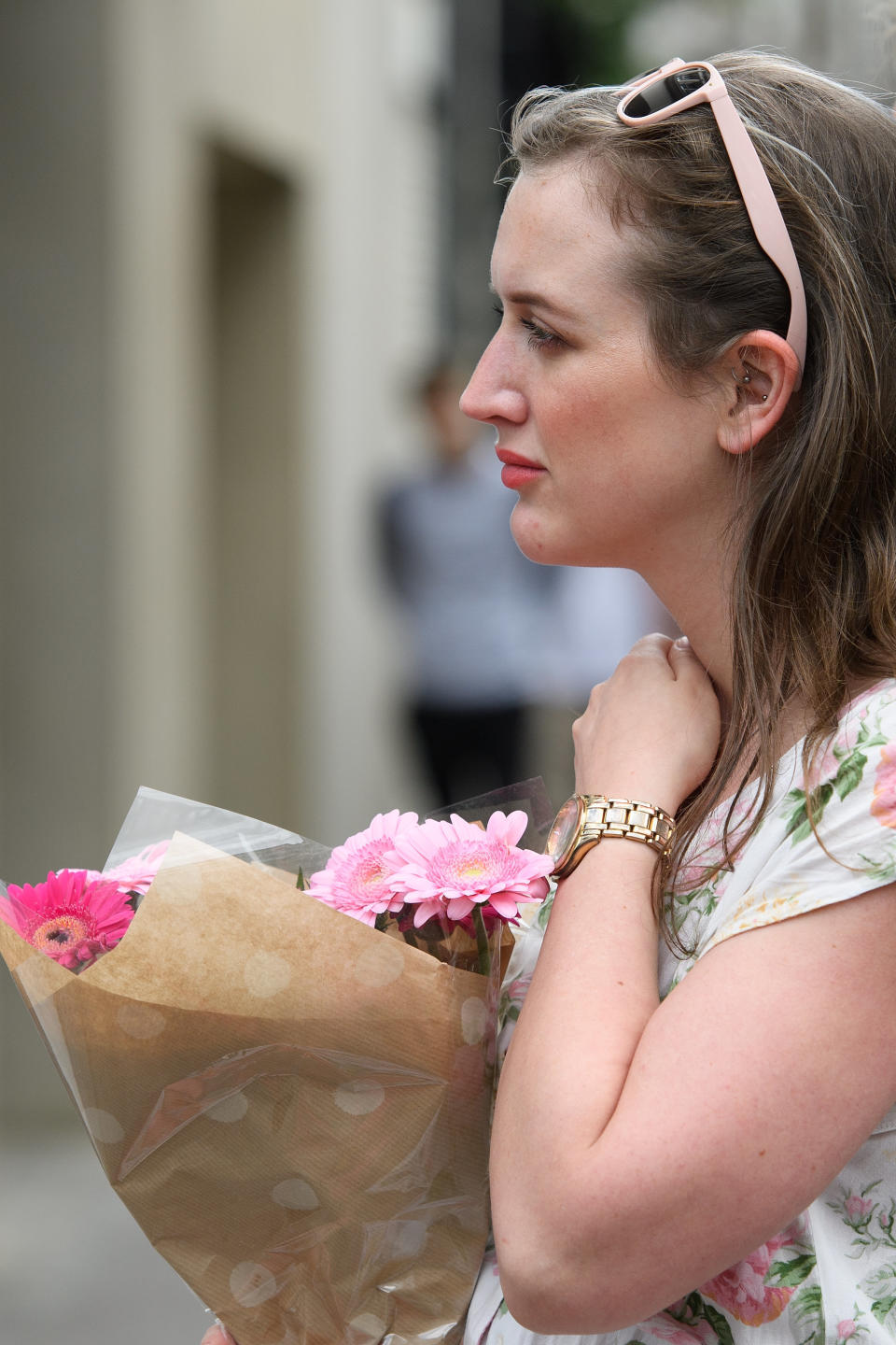 A woman prepares to lay some flowers for those killed, at the perimeter cordon, following last night's London terror attack, on June 4, 2017 in London, England.