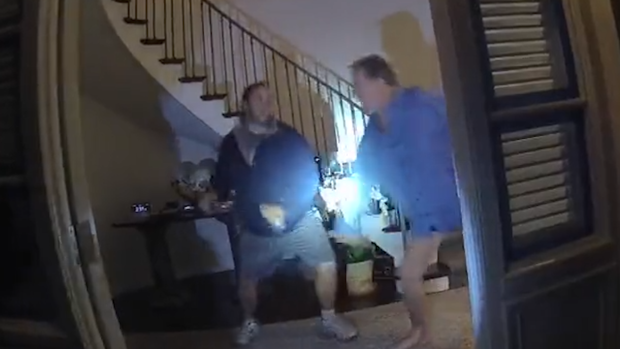 A screengrab from video taken from a police body camera shows suspect David DePape wielding a hammer before striking Paul Pelosi with it inside Pelosi's San Francisco home on Oct. 28. (Video via San Francisco Superior Court)