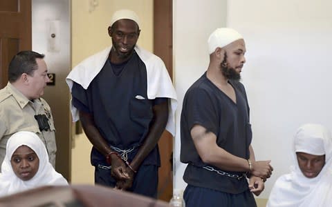 Defendants, from left, Hujrah Wahhaj, Lucas Morton, Siraj Wahhaj and Subbannah Wahhaj enter district court in Taos, New Mexico, on Monday - Credit: Albuquerque Journal