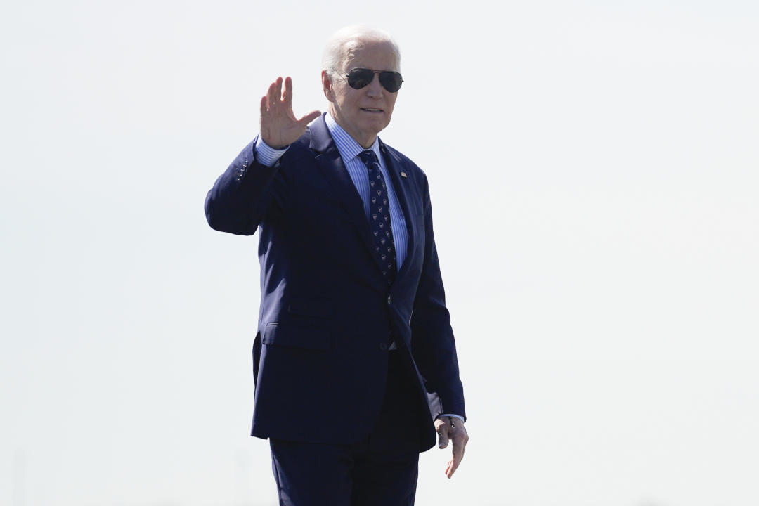 President Biden waves before boarding Air Force One on Monday.