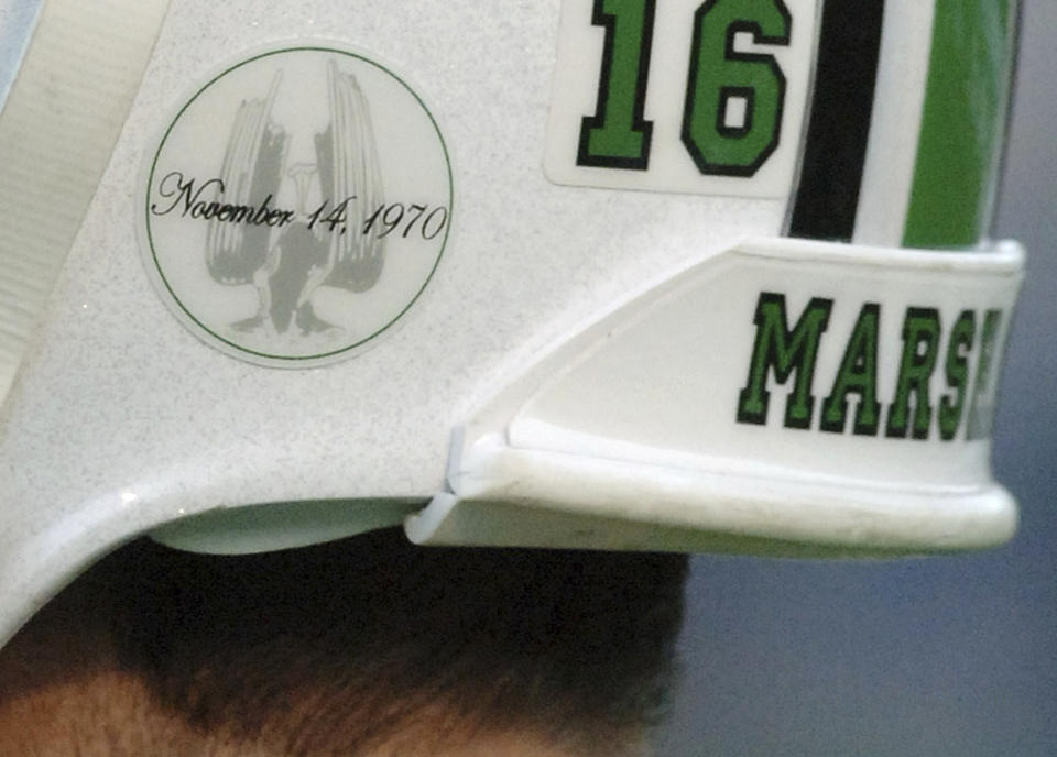 FILE - In this Nov. 19, 2005, file photo, Nov. 19, 2005, a of the Memorial Fountain at Marshall University's student center adorns quarterback Jimmy Skinner's helmet in Huntington, W.Va. The fountain is dedicated to the memory of 75 people killed in a Nov. 14, 1970, plane crash. Among the victims were 36 Marshall football players. (AP Photo/Jeff Gentner, File)