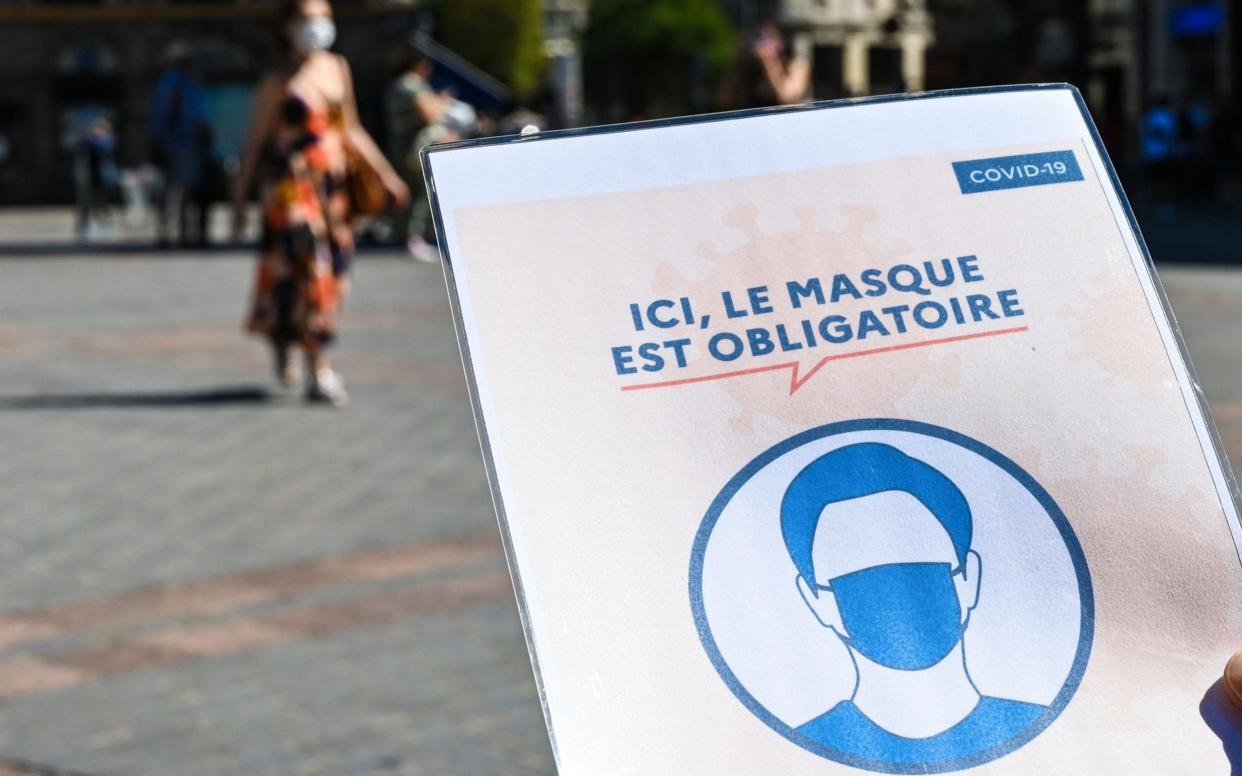 Masks have been made compulsory outdoors in dozens of French towns - Denis Charlet/AFP