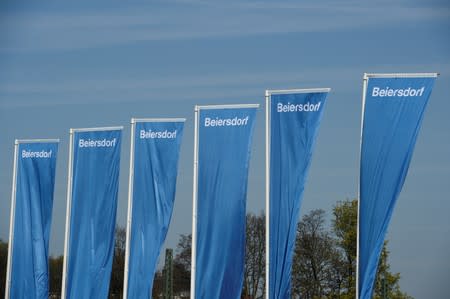 Flags of German personal-care company Beiersdorf are pictured at the annual shareholders meeting in Hamburg