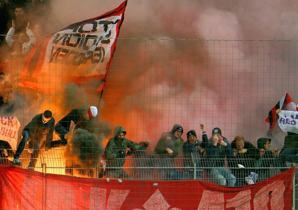 Ajax's fans light fireworks during the Europa League round of 32 second leg soccer match between Red Bull Salzburg and Ajax in Salzburg, Austria, on Thursday, Feb. 27. 2014. (AP Photo/Kerstin Joensson)