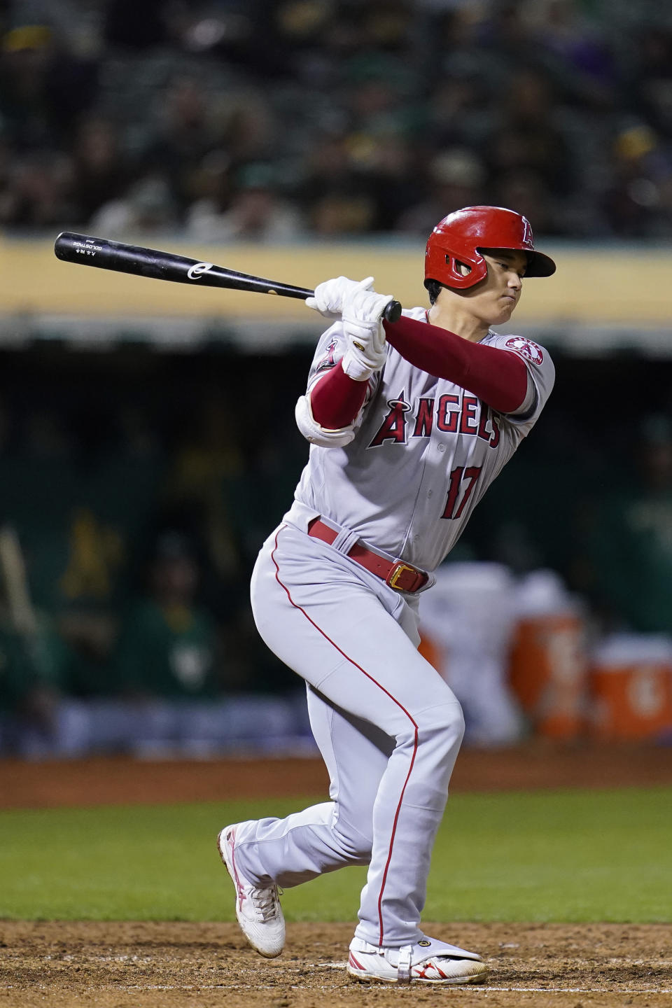 Los Angeles Angels' Shohei Ohtani strikes out against the Oakland Athletics during the eighth inning of a baseball game in Oakland, Calif., Tuesday, Oct. 4, 2022. (AP Photo/Godofredo A. Vásquez)