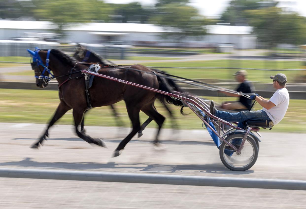 Trainers exercise horses for the upcoming harness races at the Stark County Fair. The 2023 fair starts Tuesday and runs through Labor Day at the Stark County Fairgrounds.