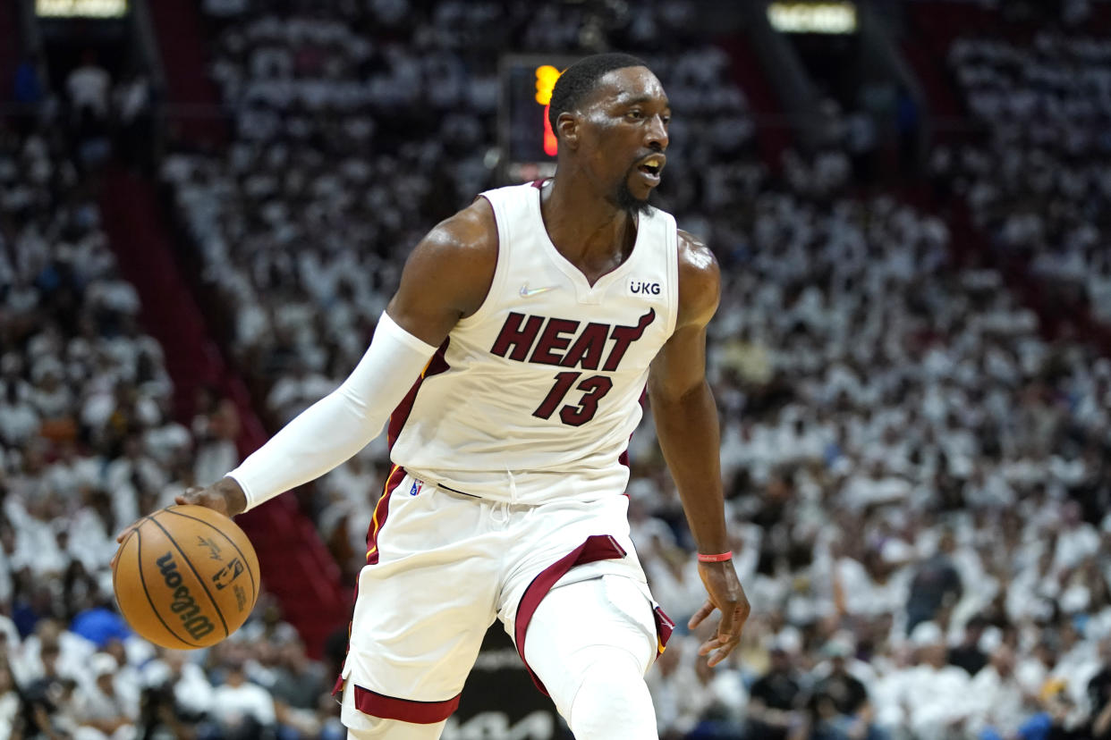 Miami Heat center Bam Adebayo (13) moves the ball down the court during the first half of Game 2 of an NBA basketball first-round playoff series against the Atlanta Hawks, Tuesday, April 19, 2022, in Miami. (AP Photo/Lynne Sladky)