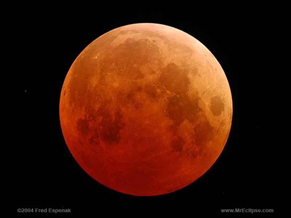 The moon turns blood-red in this image of a total lunar eclipse from 2004. A total eclipse of a "blue moon" will occur on Jan. 31, 2018. <cite>Fred Espenak/NASA</cite>