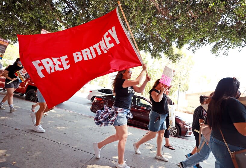 LOS ANGELES, CALIFORNIA - JULY 14: Protesters attend a #FreeBritney Rally at Stanley Mosk Courthouse on July 14, 2021 in Los Angeles, California. The group is calling for an end to the 13-year conservatorship lead by the pop star's father, Jamie Spears and Jodi Montgomery, who have control over her finances and business dealings. Planned co-conservator Bessemer Trust is petitioning the court to resign from its position after Britney Spears spoke out in court about the conservatorship. (Photo by Emma McIntyre/Getty Images)