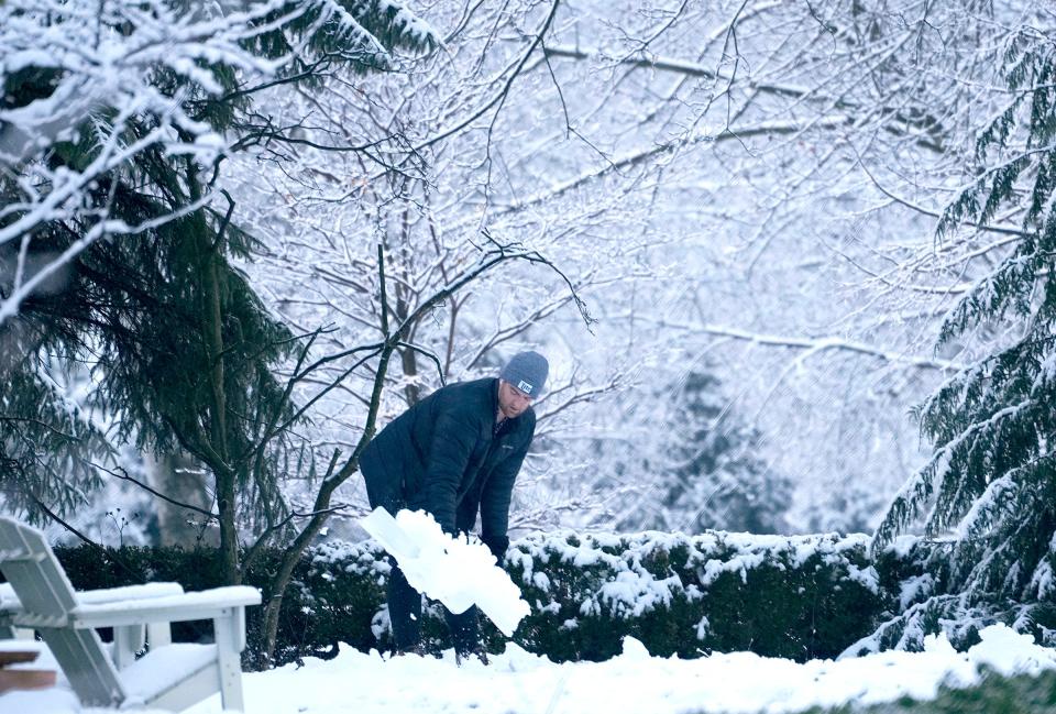 Scott McDonald shovels his driveway in Fox Point on Thursday, Feb. 15, 2024. The NWS advises extra caution when shoveling heavy, wet snow.