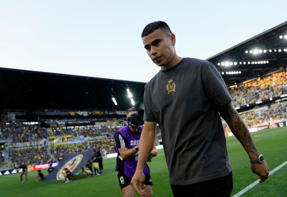 (Preferred CP art) Former Crew forward Lucas Zelarayan walks off the field after addressing fans before Monday's game against Club America.