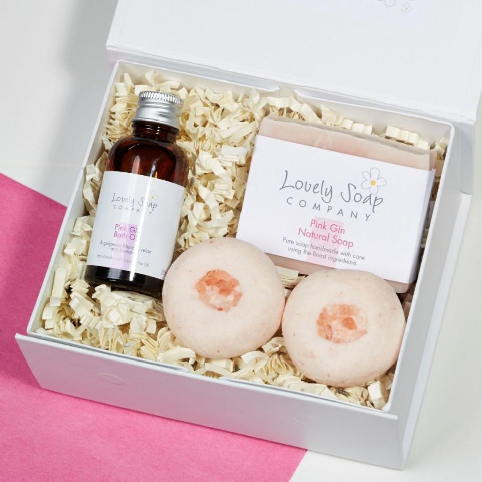 <p>A luxurious treat, this gift set – containing two bath truffles, bath oil and handmade soap – offers a selection of pamper products scented in the Lovely Soap Company's own unique blended fragrance inspired by Pink Gin.</p><p><strong>BUY NOW: </strong><strong><a rel="nofollow noopener" href="https://www.notonthehighstreet.com/lovelysoapcompany/product/personalised-pink-gin-pamper-collection-gift-set" target="_blank" data-ylk="slk:Personalised Pink Gin Pamper Collection Gift Set by Lovely Soap Company, £22.50, Notonthehighstreet.com;elm:context_link;itc:0;sec:content-canvas" class="link ">Personalised Pink Gin Pamper Collection Gift Set by Lovely Soap Company, £22.50, Notonthehighstreet.com</a></strong></p>
