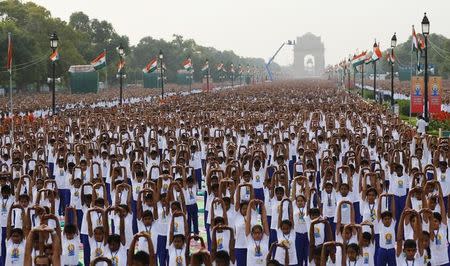 Participants perform yoga during a camp to mark the International Day of Yoga, in New Delhi, June 21, 2015. REUTERS/Adnan Abidi