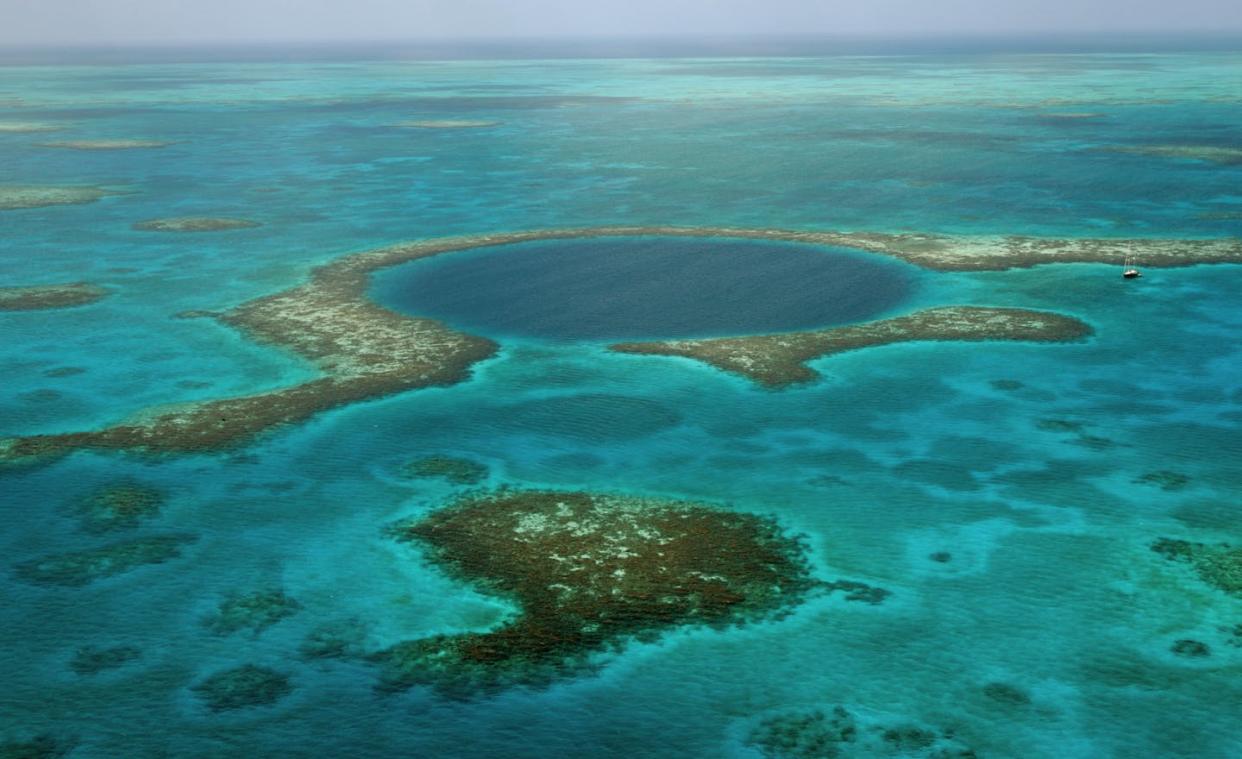 Deep 'blue holes,' like this one off Belize, can collect evidence of hurricanes. <a href="https://commons.wikimedia.org/wiki/File:Belize_Blue_Hole_(TMP)_(16912331906).jpg" rel="nofollow noopener" target="_blank" data-ylk="slk:The TerraMar Project;elm:context_link;itc:0;sec:content-canvas" class="link ">The TerraMar Project</a>, <a href="http://creativecommons.org/licenses/by/4.0/" rel="nofollow noopener" target="_blank" data-ylk="slk:CC BY;elm:context_link;itc:0;sec:content-canvas" class="link ">CC BY</a>