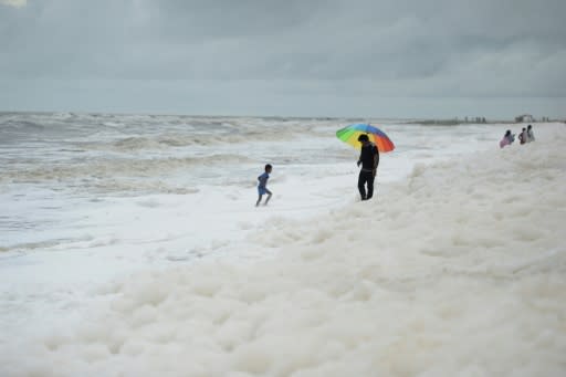 Word of the risks have not got through to the hundreds of families who throng India's longest urban beach, letting children happily skip in the toxin-filled froth