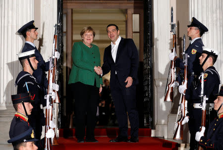 Greek Prime Minister Alexis Tsipras welcomes German Chancellor Angela Merkel at the Maximos Mansion in Athens, Greece, January 10, 2019. REUTERS/Alkis Konstantinidis