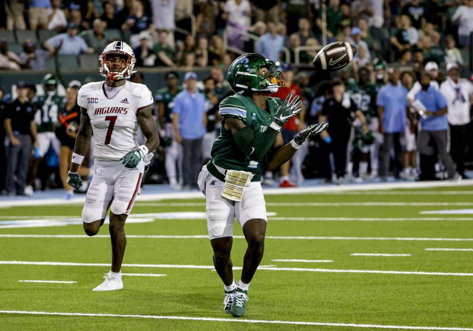 Tulane wide receiver Jha'Quan Jackson (4) catches a touchdown pass past South Alabama cornerback Marquise Robinson (7) during the second quarter of an NCAA college football game in New Orleans on Saturday, Sept. 2, 2023. (AP Photo/Derick Hingle)