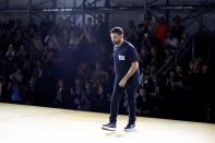 Burberry's Chief Creative Officer Riccardo Tisci takes a bow at the end of the Burberry SS20 show. [Photo Getty]