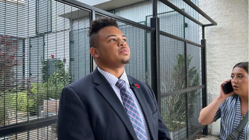 Columbus City School board member Brandon Simmons pauses before both apologizing and placing blame for a leaked memo concerning school board policies on school closures.