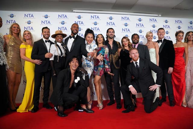 Large group of Strictly dancers on a red carpet