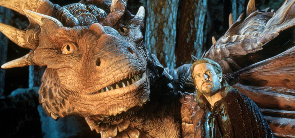 Dennis Quaid and dragon looking up in a scene from the film 'DragonHeart', 1996. (Photo by Universal/Getty Images)