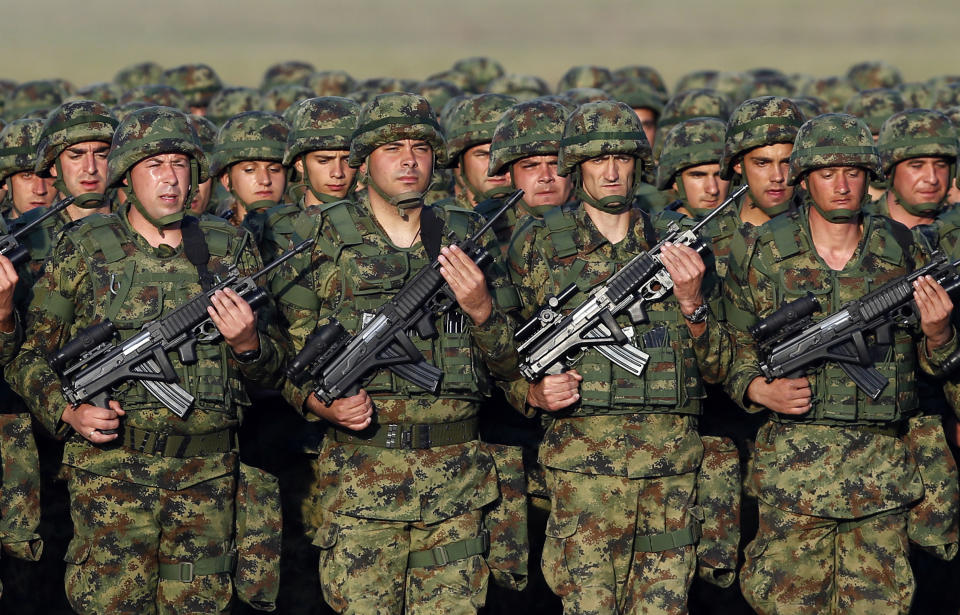 In this photo taken on Tuesday, Oct. 17, 2017, Serbian Army soldiers perform during rehearsal exercise in Batajnica, military airport near Belgrade, Serbia. Serbia's prime minister warned on Wednesday, Dec. 5, 2018 that the formation of a Kosovo army could trigger Serbia's armed intervention in the former province — the bluntest warning so far amid escalating tensions in the Balkans. (AP Photo/Darko Vojinovic)