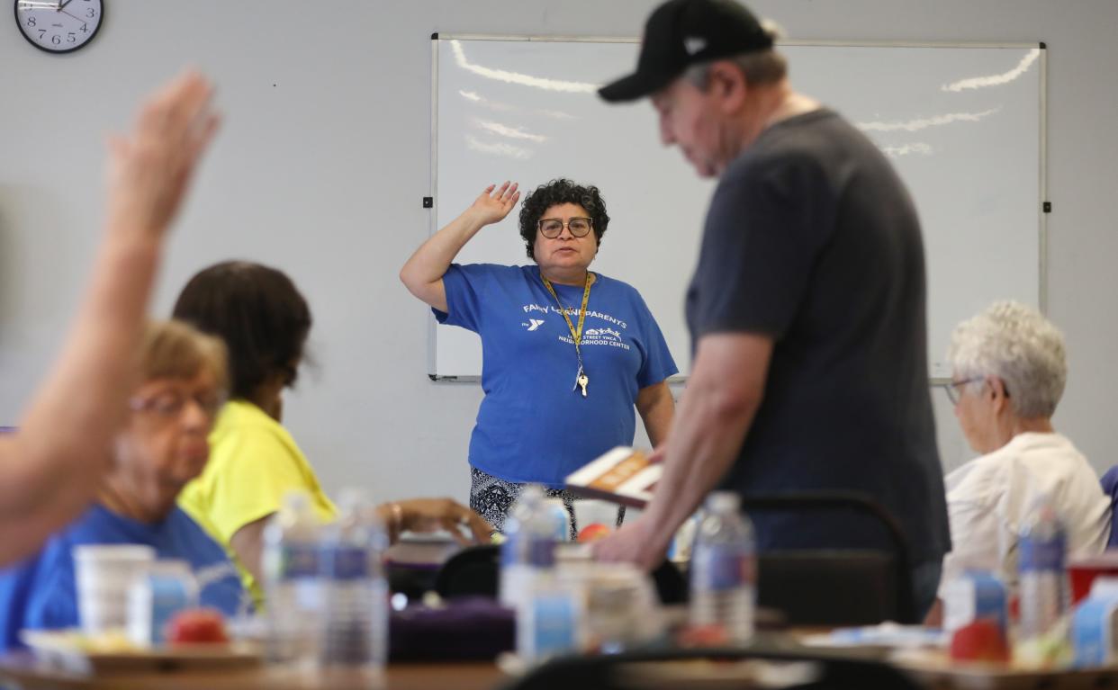 Nancy Maciuska takes a vote on support for an upcoming event during a meeting of the Fairy Grandparents neighborhood group at the Lewis Street YMCA Neighborhood Center Friday, May 3, 2024 in Rochester.