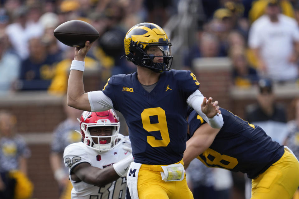 Michigan quarterback J.J. McCarthy (9) throws against UNLV in the first half of an NCAA college football game in Ann Arbor, Mich., Saturday, Sept. 9, 2023. (AP Photo/Paul Sancya)