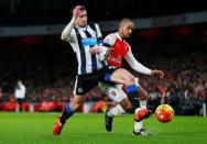 Football Soccer - Arsenal v Newcastle United - Barclays Premier League - Emirates Stadium - 2/1/16 Arsenal's Theo Walcott in action with Newcastle's Daryl Janmaat Reuters / Eddie Keogh Livepic