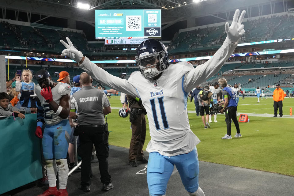Tennessee Titans wide receiver Chris Moore (11) celebrates at the end of an NFL football game against the Miami Dolphins, Monday, Dec. 11, 2023, in Miami. The Titans defeated the Dolphins 28-27. (AP Photo/Lynne Sladky)
