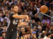 Dec 5, 2015; Toronto, Ontario, CAN; Golden State Warriors guard Stephen Curry (30) passes to a teammate during the Warriors 112-109 win over Toronto Raptors at Air Canada Centre. Curry had 44 points and seven assists. Mandatory Credit: Dan Hamilton-USA TODAY Sports