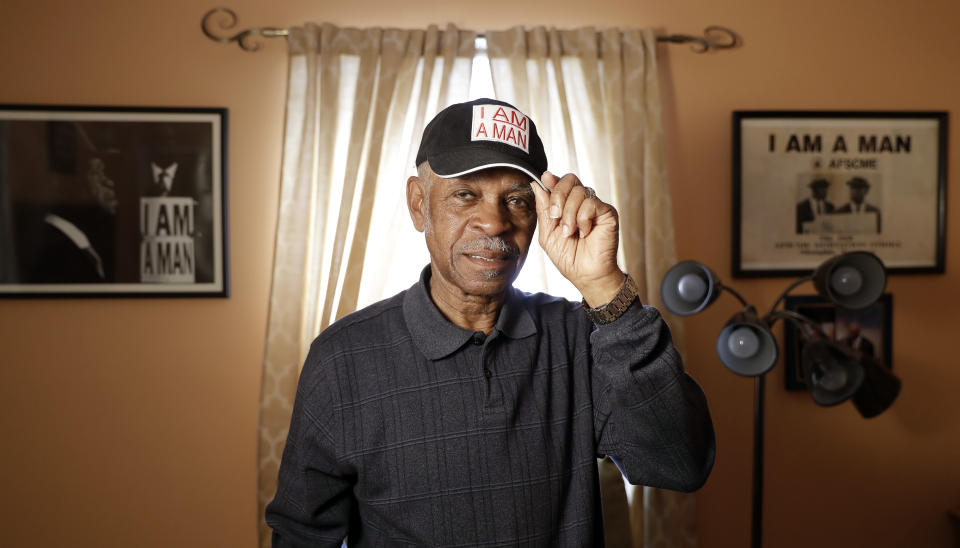 FILE - Sanitation worker Elmore Nickleberry wears a cap with the slogan "I AM A MAN" in a room in his home that displays items commemorating the civil rights movement on March 15, 2018, in Memphis, Tenn. Nickleberry, the longtime Memphis sanitation worker who participated in the pivotal 1968 strike that brought the Rev. Martin Luther King to the city where the civil rights leader was killed, died, Saturday, Dec. 30, 2023, in Memphis, according to an obituary by R.S. Lewis and Sons Funeral Home. He was 92. (AP Photo/Mark Humphrey, File)