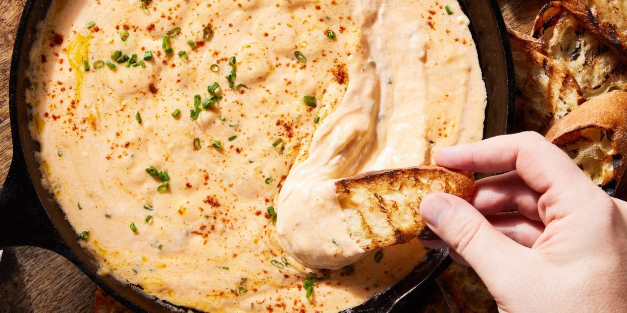 skillet beer cheese with a piece of toasted bread