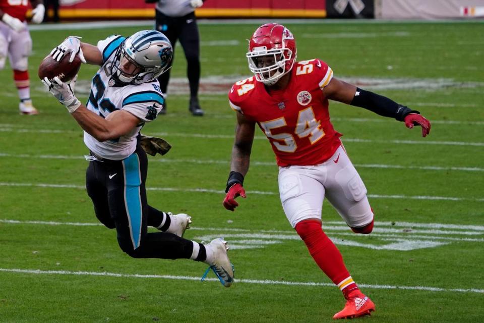 Carolina Panthers running back Christian McCaffrey, left, catches a pass in front of Kansas City Chiefs outside linebacker Damien Wilson (54) during the second half of an NFL football game in Kansas City, Mo., Sunday, Nov. 8, 2020. (AP Photo/Jeff Roberson)