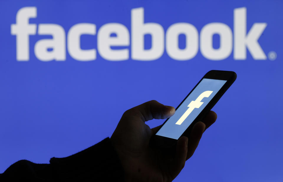 PARIS, FRANCE - SEPTEMBER 09: In this photo illustration, the Facebook logo is displayed on the screen of a smartphone in front of a computer screen displaying the logo of Facebook on September 09, 2019 in Paris, France. Several US states have launched antitrust investigations against web giants including Facebook and Google with the viewer their business practices, but also the collection and exploitation of personal data. In total, eight states have announced, via the attorneys general, the opening of an antitrust investigation against Facebook social media. (Photo by Chesnot/Getty Images)