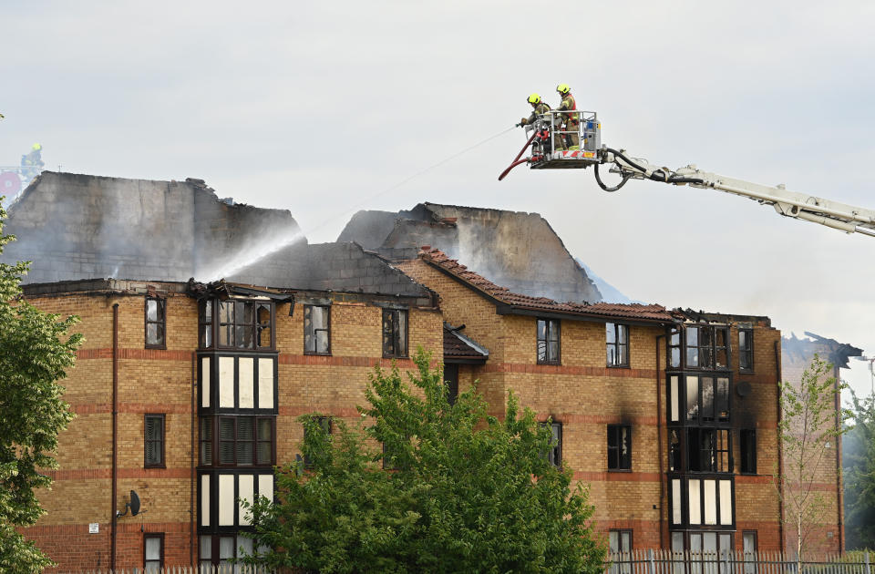 Firefighters at the scene of a gas blast in Redwood Grove, Bedford, where two people were injured, one seriously, after the explosion caused an 