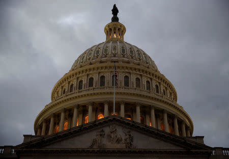 The U.S. Capitol building is lit at dusk ahead of planned votes on tax reform in Washington, U.S., December 18, 2017. REUTERS/Joshua Roberts/Files