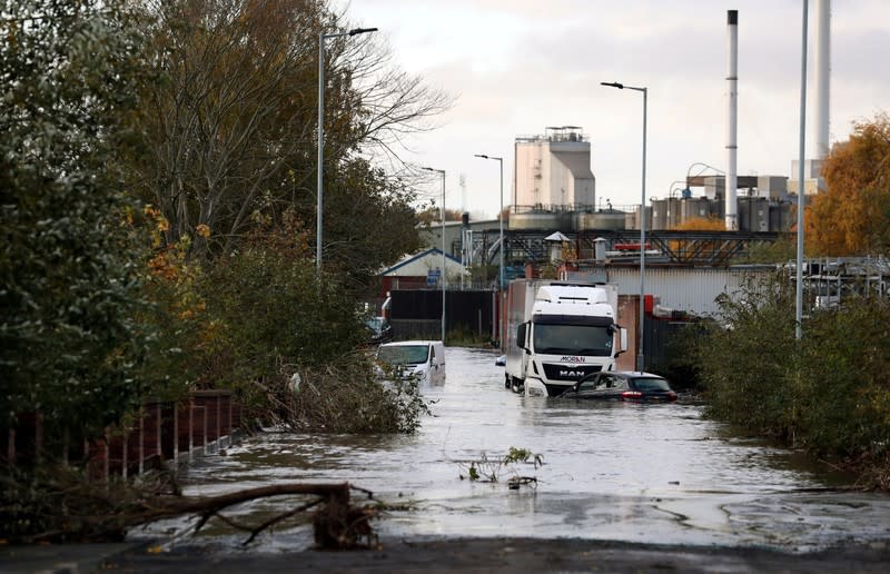 Vehicles sit in floodwater in Rotherham, near Sheffield