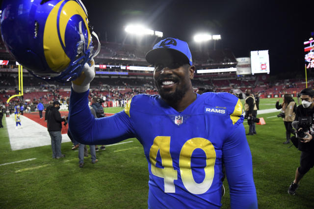 Los Angeles Rams defensive end Aaron Donald (99) celebrates during the  first half of an NFL wild-card playoff football game against the Arizona  Cardinals in Inglewood, Calif., Monday, Jan. 17, 2022. (AP