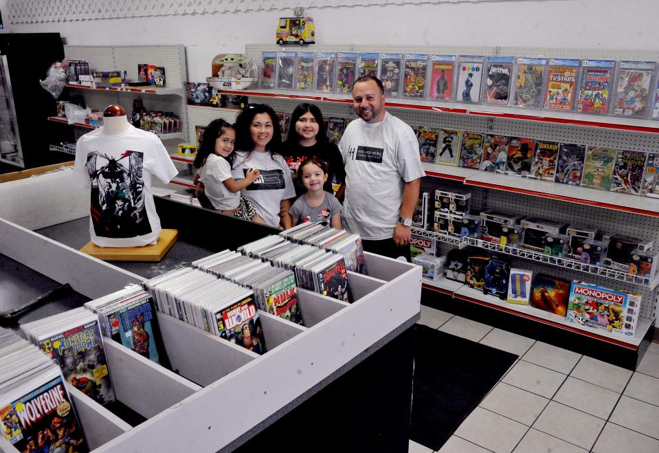Angela and Jorge Vega with their three children Carrlita, Laylonil and Havanna will soon be opening His and Hers Comic Book Store in Rittman.