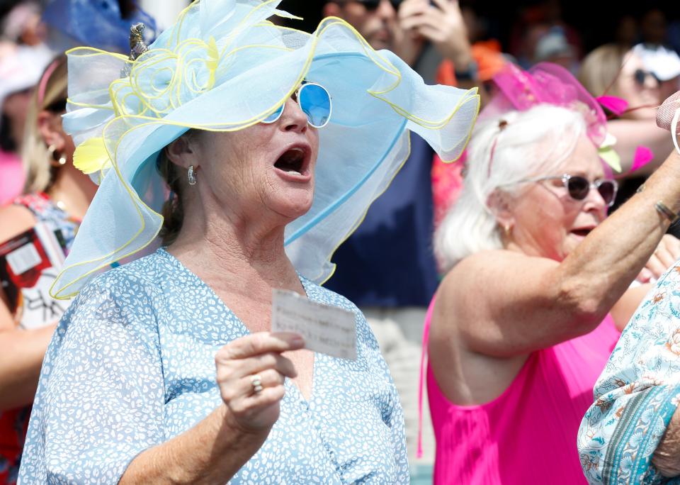 People cheer the horses for the Village 8 Theaters race at 502’sDay at Churchill Downs. 
April 30, 2024