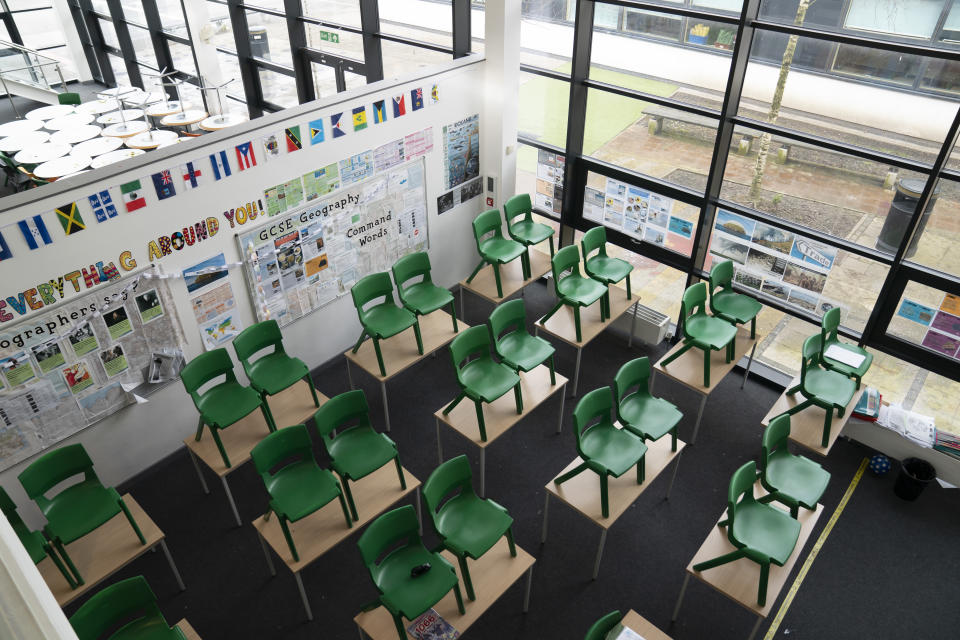 An empty classroom at Great Academy Ashton, as the school prepares for its reopening on March 8 after the latest lockdown curb the spread of coronavirus, in Ashton-Under-Lyne, England, Thursday, March 4, 2021. The school for approximately 1300 pupils aged 11 to 16 in Greater Manchester will have to conduct around 450 tests per day on pupils and staff in the first 2 weeks after the return of students on Monday. (AP Photo Jon Super)