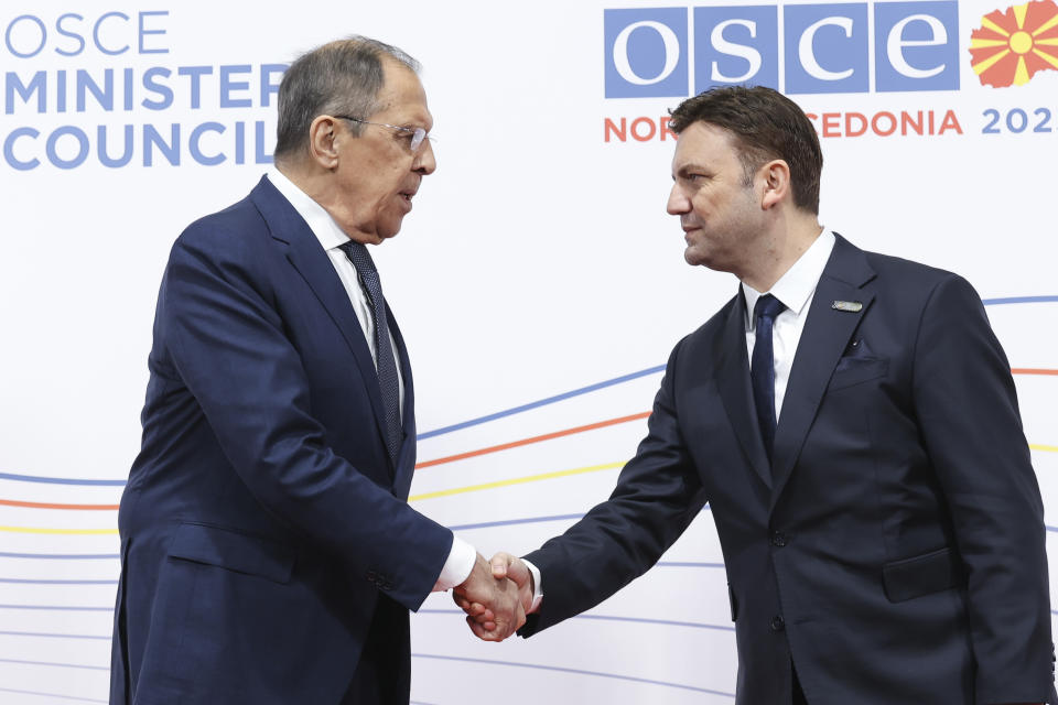 In this photo released by Russian Foreign Ministry Press Service, Russian Foreign Minister Sergey Lavrov, left, shakes hands with North Macedonia's Foreign Minister Bujar Osmani at the beginning of the OSCE (Organization for Security and Co-operation in Europe) Ministerial Council meeting, in Skopje, North Macedonia, on Thursday, Nov. 30, 2023. (Russian Foreign Ministry Press Service via AP)