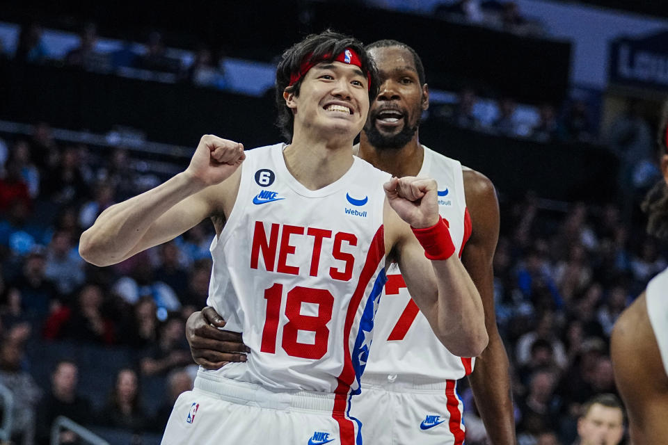 Brooklyn Nets forward Yuta Watanabe (18) reacts to a foul call during the first half of an NBA basketball game against the Charlotte Hornets, Saturday, Nov. 5, 2022, in Charlotte, N.C. (AP Photo/Rusty Jones)