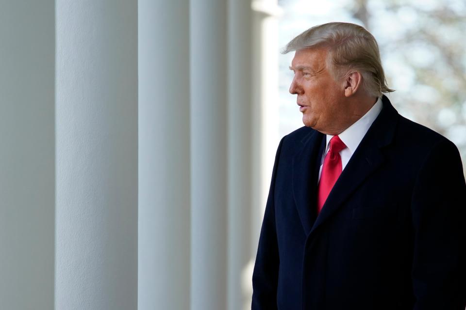 <p>Donald Trump walks out of the Oval Office and towards the Rose Garden on 24 November. </p> (AP)