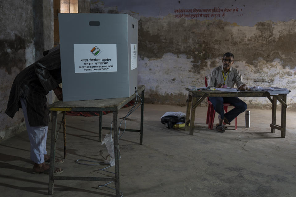 A man casts his vote during the third round of voting in the six-week-long general election in Agra, Uttar Pradesh, India, Tuesday, May 7, 2024. (AP Photo/Altaf Qadri)