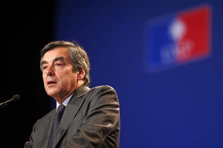 Francois Fillon, former French prime minister and UMP deputy delivers a speech as he attends the UMP political party's national council in Paris January 25, 2014. REUTERS/Benoit Tessier