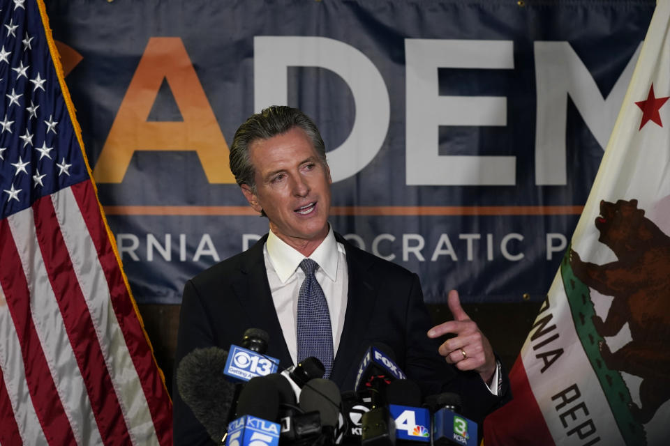 California Gov. Gavin Newsom addresses reporters after beating back the recall that aimed to remove him from office at the John L. Burton California Democratic Party headquarters in Sacramento, Calif., Tuesday, Sept. 14, 2021. (AP Photo/Rich Pedroncelli)