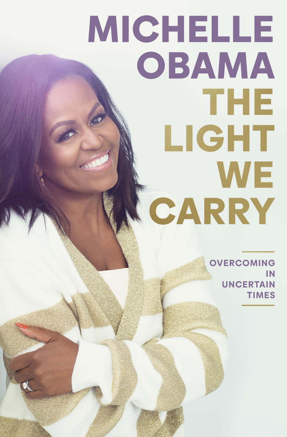 This cover image released by Crown/Penguin Random House shows "The Light We Carry" by Michelle Obama. The former first lady plans a six-city tour this fall in support of her new book, “The Light We Carry: Overcoming in Uncertain Times,” beginning mid-November in Washington. D.C. and ending a month later in Los Angeles. (Crown/PRH via AP)